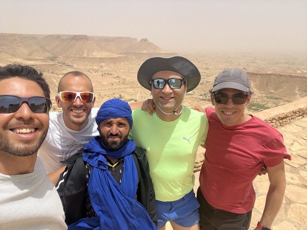 Travellers and a local guide together above the southern Tunisian plateau